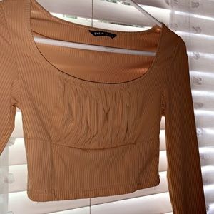 nude ruffled long sleeve